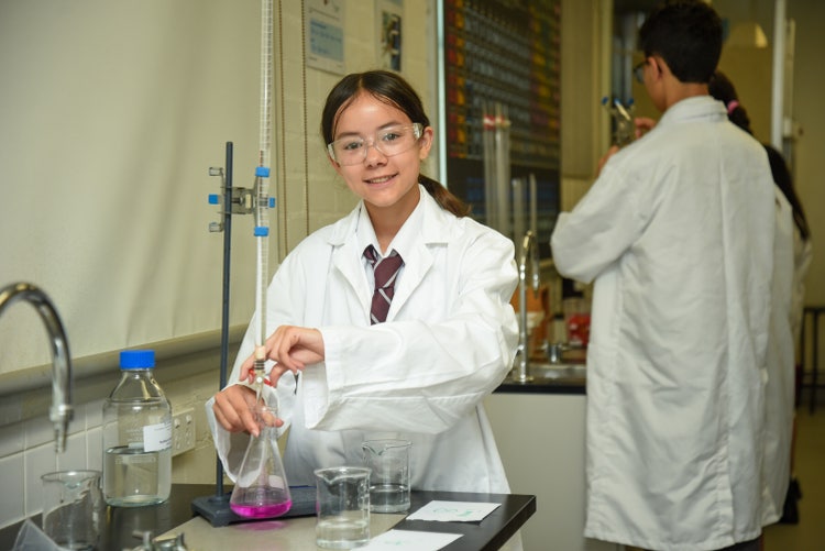 student in a science lab