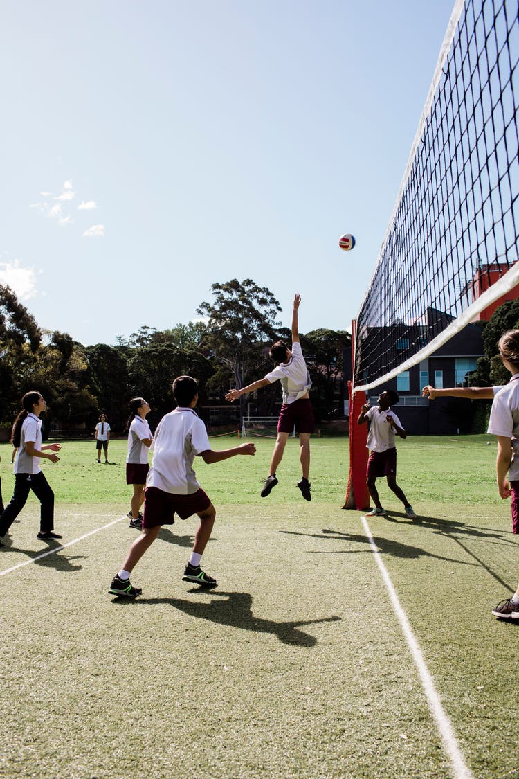 students playing volleyball